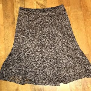 A long brown and black JH Collectibles skirt.